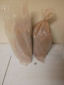 lot 985 image: 2 Bundles of Slack or Clay.  Located in basement