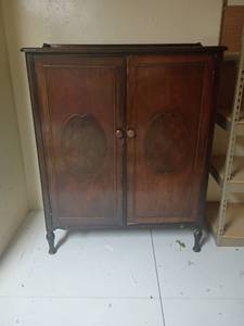 lot 989 image: Loomis and Hart Furniture Co. Vintage Wardrobe.   53 x 42 x 23.  Located in basement
