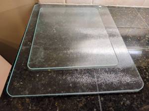 lot 1101 image: 2 glass cutting boards. Largest is 20x16