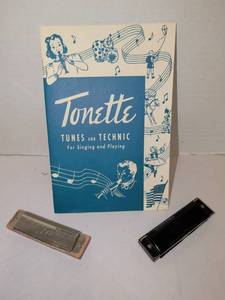 lot 1285 image: Tonette Tunes and Technic Instruction Book with 2 Harmonicas Lot