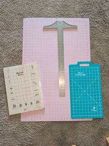 lot 1340 image: Crafting Cutting Mats and Rulers Lot - Pink Grid Mat, Fleece Cutting Mat, Macrame Board, T-Square Ruler