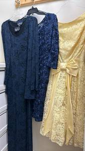 lot 1431 image: Three dresses - long navy blue dress with jacket size L, navy short dress - 16, and a yellow dress&nbsp