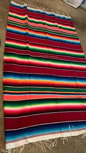 lot 1528 image: Striped Woven Blanket with Fringe Red Blue Green Yellow Orange and collapsible hamper