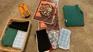 lot 1530 image: Place mats, napkins and koozie