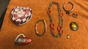 lot 1701 image: Ladies jewelry, phone ear blue tooth and Brighton tin