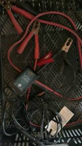lot 3131 image: Jumper cables and battery charger in plastic bin