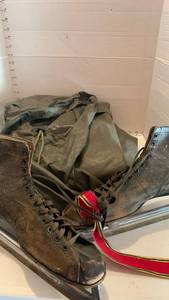 lot 3144 image: Vintage ice skates and a rain poncho