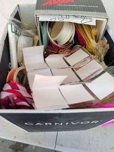 lot 3221 image: Holiday mystery box containing ribbon gift tags, and more
