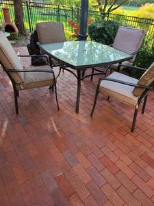 lot 4204 image: Glass top patio table, 24x42x42, with four chairs and cushions