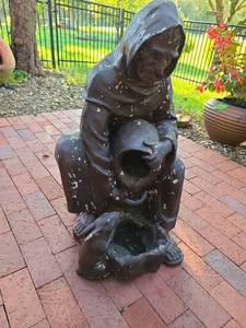 lot 4205 image: Friar feeding water to a bunny, resin or plastic, 32in tall
