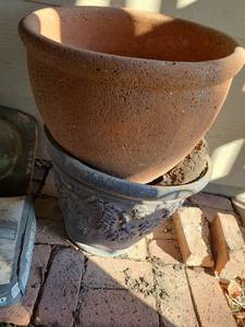 lot 4218 image: Resin pot, 15in tall, and clay pot.