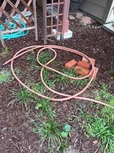 lot 4220 image: Orange garden hose, shepherds hook, 82in