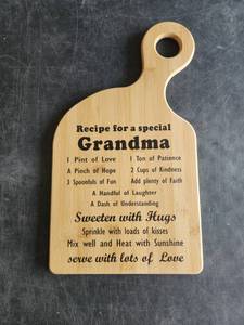lot 4107 image: Recipe for a Special Grandma Engraved Cutting Board with Handle