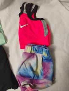 lot 35685 image: Girls pink Nike tank top size 3T, Tie Dye shorts, DKNY black pants size 4T, green Under Armour T-shirt size 2T