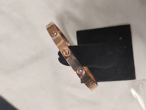 lot 35824 image: LvL 5 Replica - Gold Cartier Bracelet.