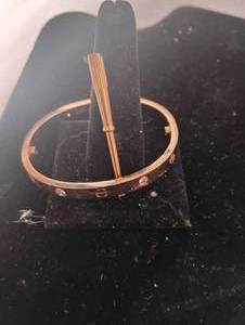 lot 35839 image: LvL 5 Replica - Gold Cartier Bracelet.