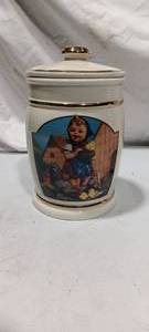lot 36057 image: The M.J. Hummel Canister Collectio Feeding Time Vintage
