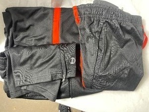 lot 35746 image: new-youth boy holloway xl black and orange polyester athletic pant