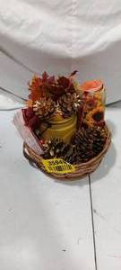 lot 35949 image: Bundle of fall decor in a wicker basket, napkins, yellow vase with fall leaves and pine cones