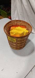 lot 35951 image: Wicker basket with yellow and orange napkins