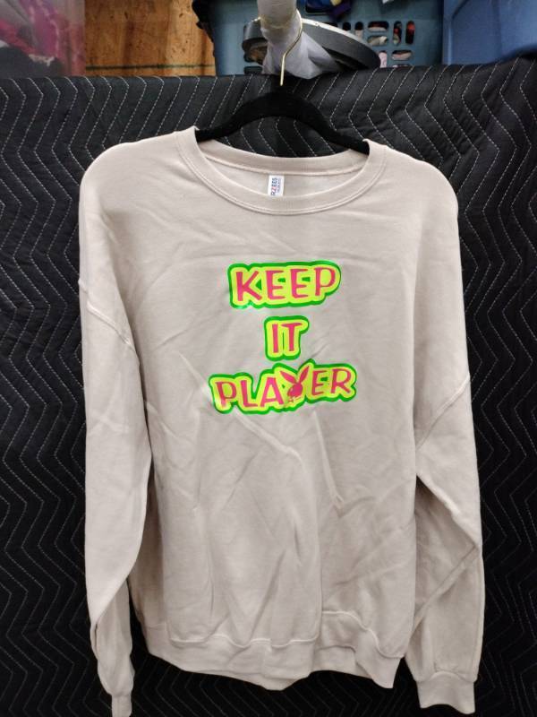 lot 9102 image: Jerzees Nublend XL Crewneck Sweatshirt Tan w Keep It Player Neon Graphic