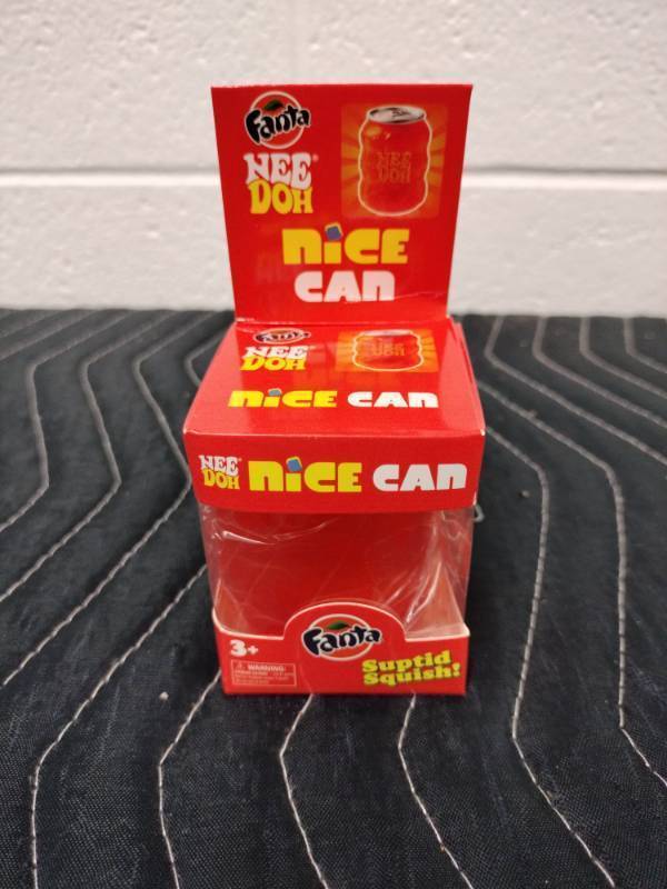 lot 66 image: Schylling Fanta NeeDoh Nice Can Squishy Toy, Orange Can Shape, Boxed