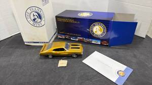 lot 1002 image: 1970 Oldsmobile 4-4-2 gold and black scale model die cast car with box
