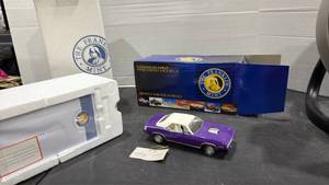 lot 1014 image: 1970 Plymouth Hemicuda Challenger purple scale model car with box