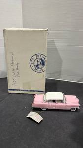 lot 1035 image: 1955 Elvis Presley Cadillac Fleetwood pink scale model die cast car with box