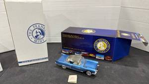lot 1036 image: 1957 Cadillac Brougham blue scale model die cast car with box