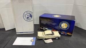 lot 1039 image: 1957 Plymouth Fury cream scale model die cast car with box