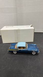 lot 1041 image: 1958 Packard Hawk blue scale model die cast car with box