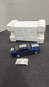 lot 1047 image: 2008 Ford Shelby GT500KR blue and silver scale model die cast car with styrofoam