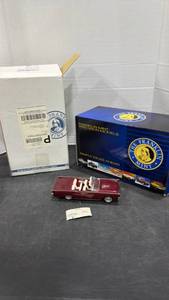 lot 1048 image: 1961 Lincoln Continental convertible Burgundy scale model die cast car with box