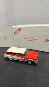 lot 1054 image: 1958 Bermuda Six-Passenger Station Wagon orange and white scale model die cast car with box