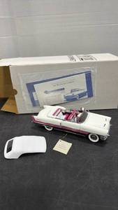 lot 1055 image: 1955 Packard Caribbean convertible white and pink scale model die cast car with box