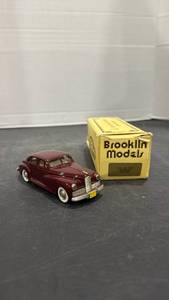 lot 1074 image: 1941 Packard Clipper Brooklin Models 143 scale die cast metal automobile with box