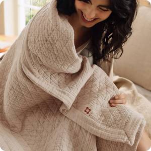 lot 1079 image: Bedsure PureWoven 100% Cotton Muslin Blanket 8-Layer Queen Taupe Brown