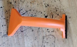 lot 2297 image: Orange Handheld Scraper Tool with Replaceable Blade and Blue Grip Insert