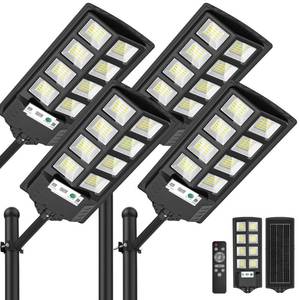 lot 5712 image: WYWNA Solar Flood Lights Outdoor 6000K LED Motion Sensor Waterproof 4-Pack  Retail $119.99