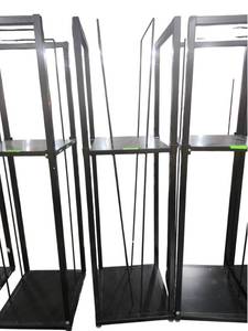 lot 539 image: Black Steel Two-Shelf Freestanding Rack with Vertical Rods and Leveling Feet