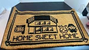lot 70310 image: Door Mat with Building House Design - Retail $20