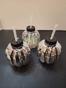 lot 71132 image: Set of 3 Pumpkin Face Beverage Bottles with Black Screw Cap Lids and Straws - Retail $6