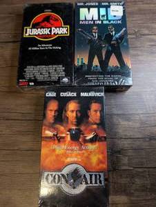 lot 1426 image: VHS Lot of 3 ActionAdventure &amp Sci-fi Tapes Jurassic Park, Men in Black, Con Air