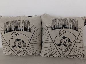 lot 13292 image: Oklahoma State Cowboys Woven Throw Pillows Set of 2 with Pistol Pete Design