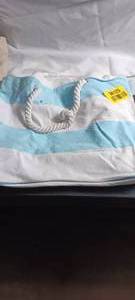 lot 36125 image: The Global 50th Anniversary Cruise White and Light Blue striped bag