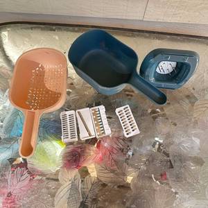 lot 45 image: Handheld Scoop-Style Vegetable Slicer Set with Strainer and 4 Blade Inserts