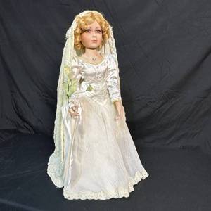 lot 205 image: Bride Doll with Blonde Curled Hair, Lace Veil and Cream Gown