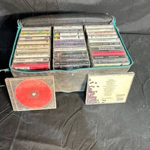 lot 209 image: Assorted Music Cassette Tapes and CDs Lot with Zippered Carrying Case