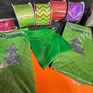 lot 248 image: Holiday Time Christmas Gift Wrap Lot with Ribbon, Bags and 53x108 Table Cover